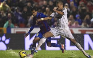 Pepe challenges for the ball.